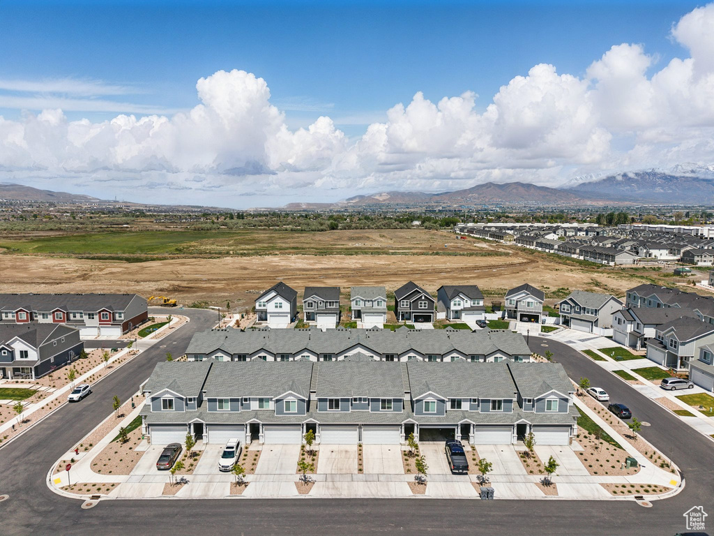Aerial perspective of suburban area with a mountainous background
