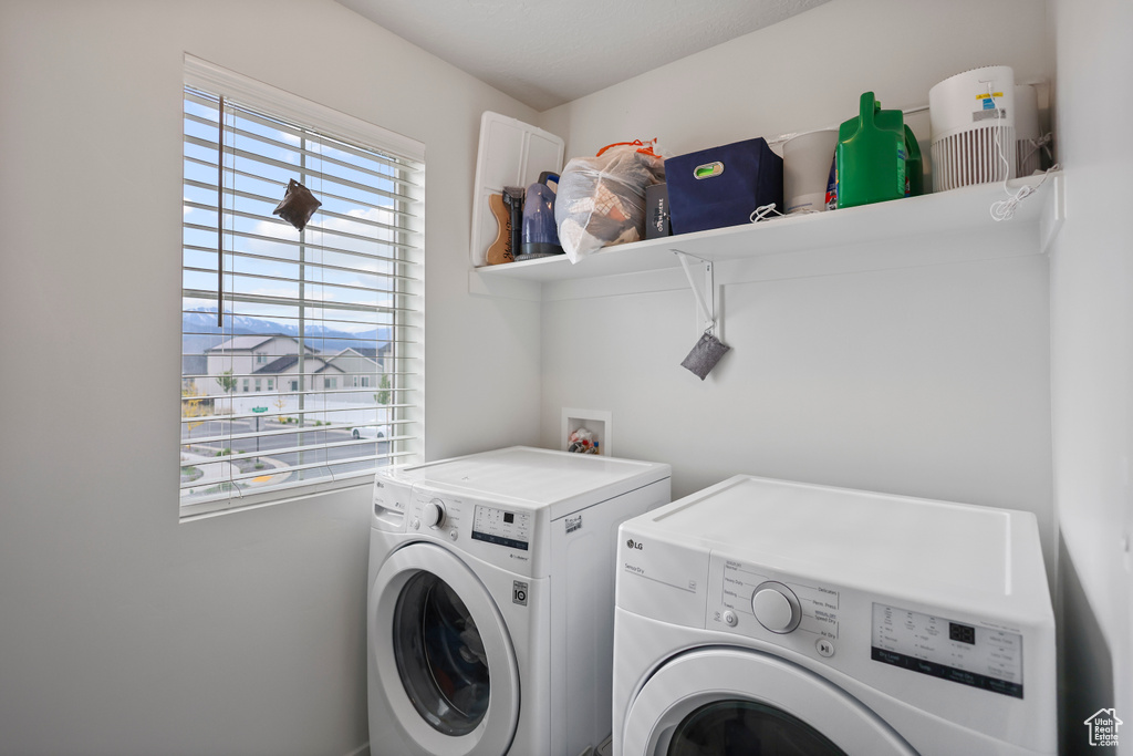 Laundry area featuring separate washer and dryer