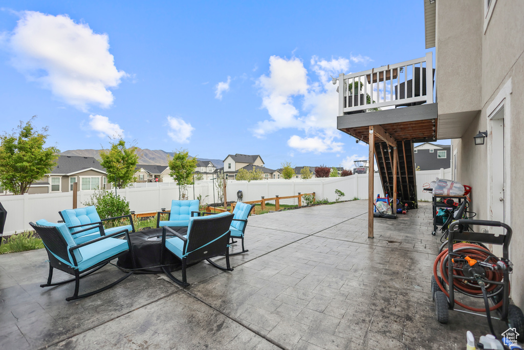 View of patio with a fenced backyard and a residential view