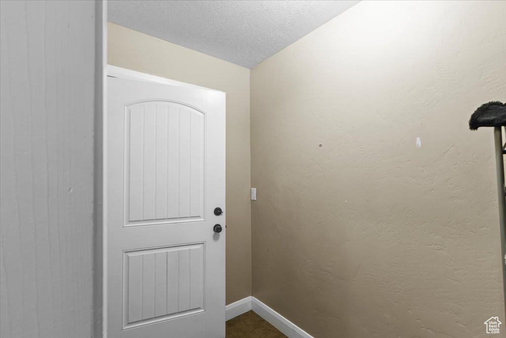 Doorway to outside with baseboards