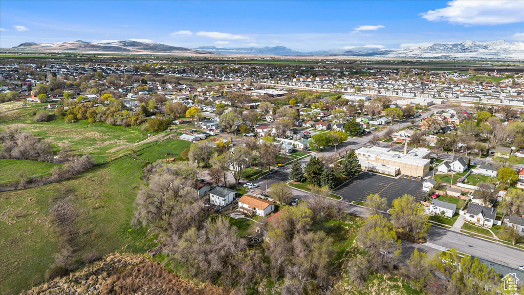 View of property location with a mountain backdrop and nearby suburban area