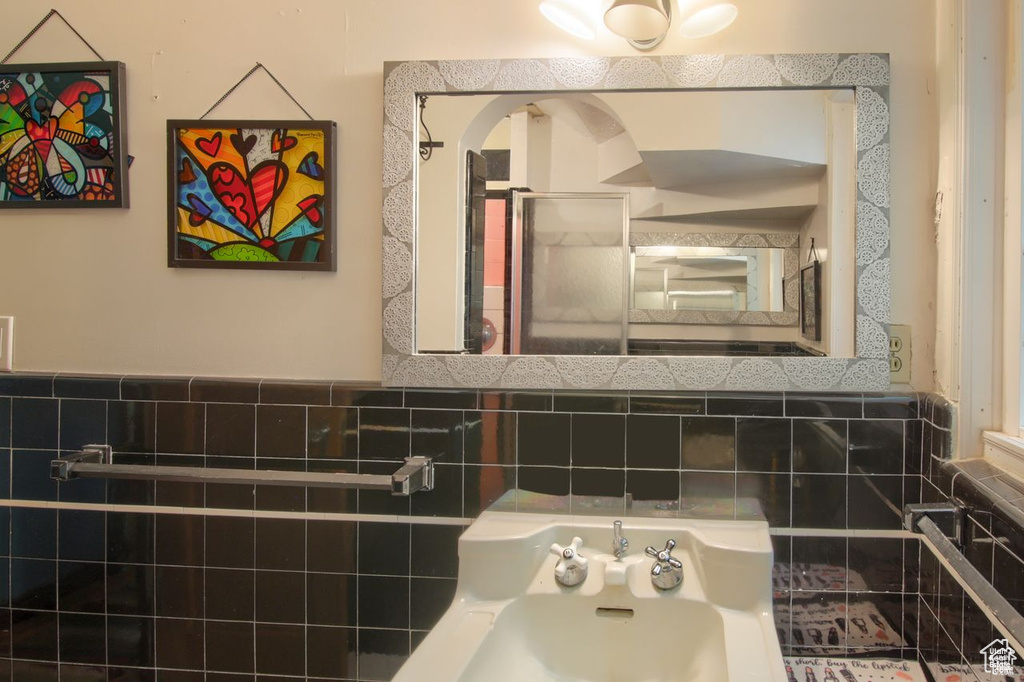 Full bath with tile walls