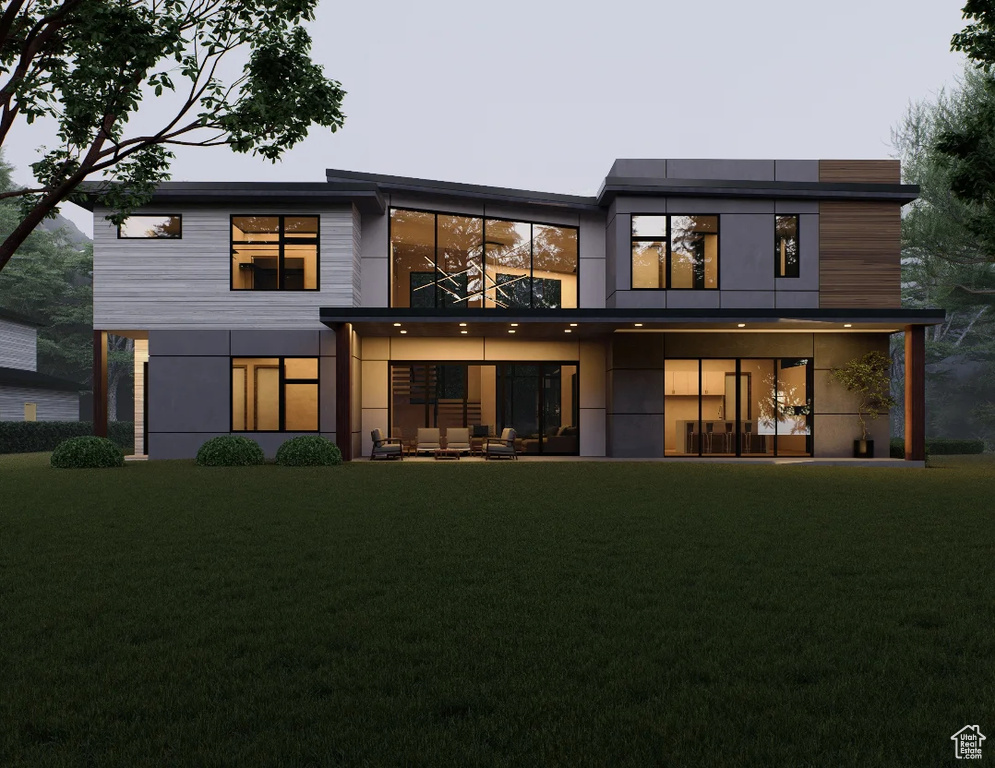 Back of property with a yard