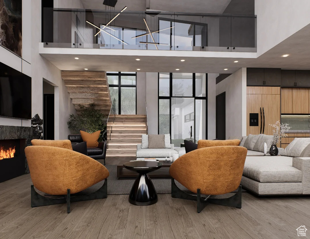 Building lobby with a towering ceiling, stairs, and recessed lighting