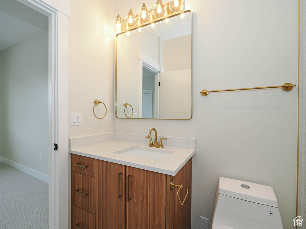 Bathroom featuring vanity and toilet