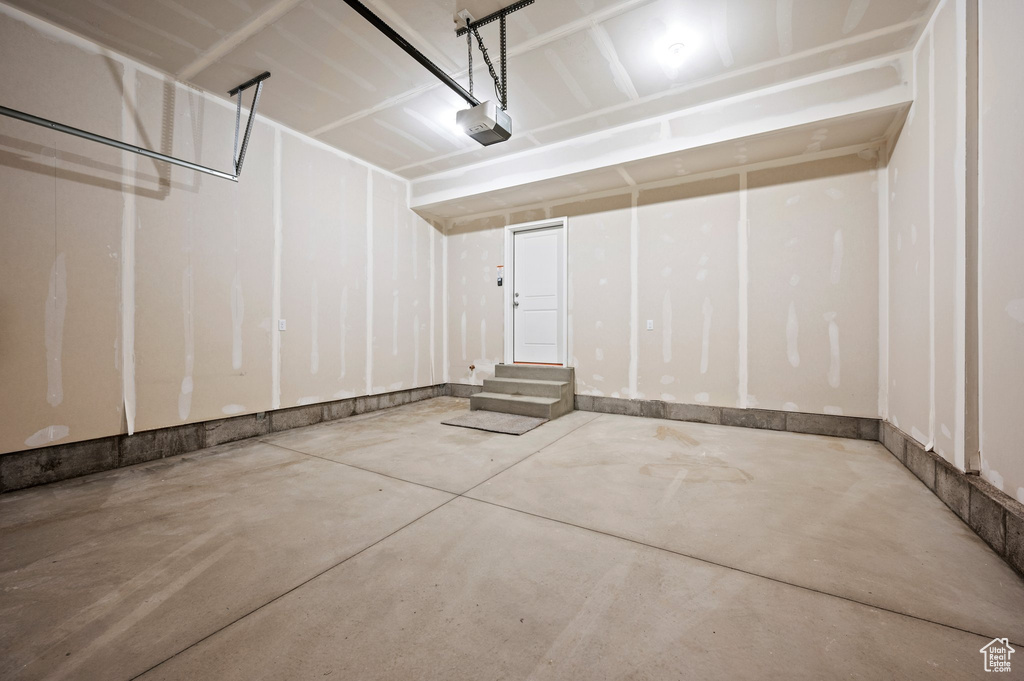 Garage featuring a garage door opener