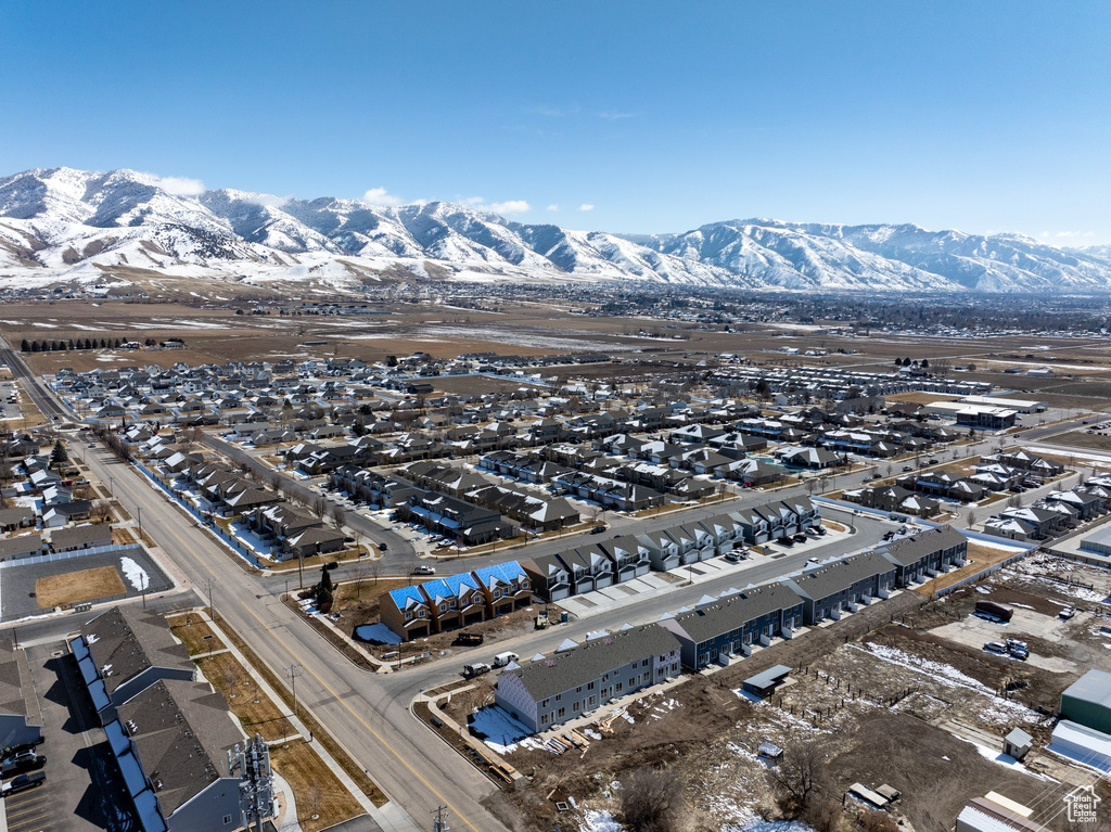 View of property location featuring a mountain backdrop and nearby suburban area
