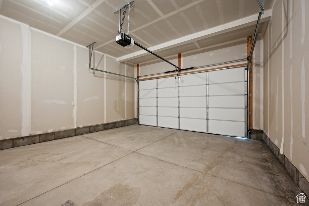 Garage featuring a garage door opener