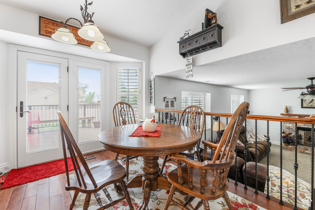 Dining space featuring a wealth of natural light, ceiling fan, and wood finished floors