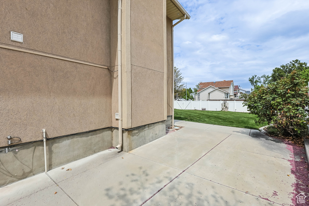 View of patio with fence