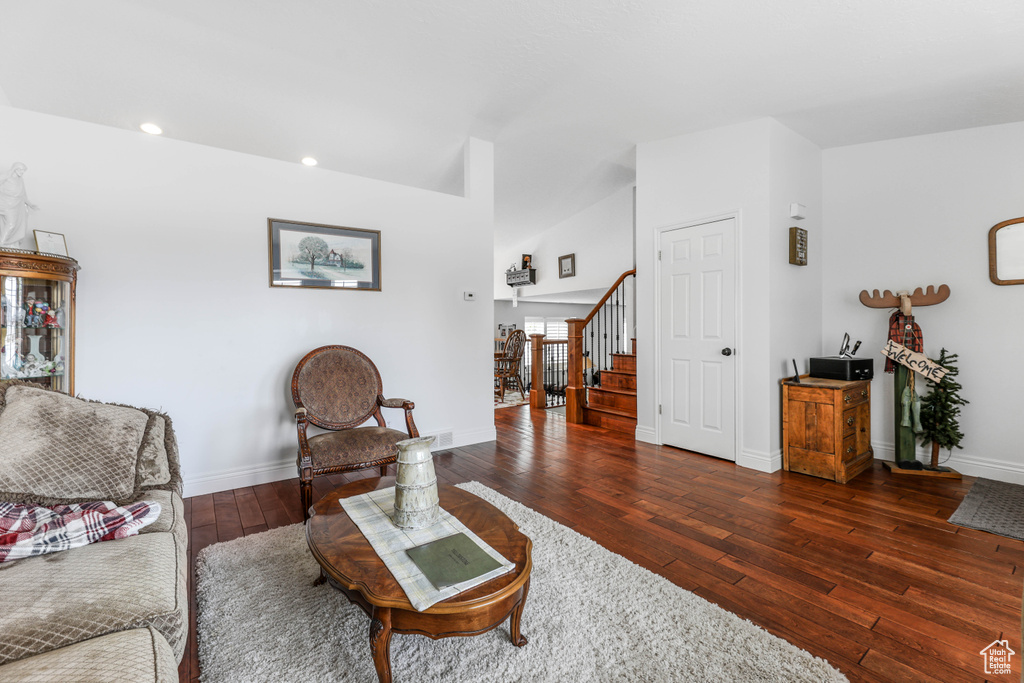 Living room with stairway, baseboards, hardwood / wood-style floors, and recessed lighting