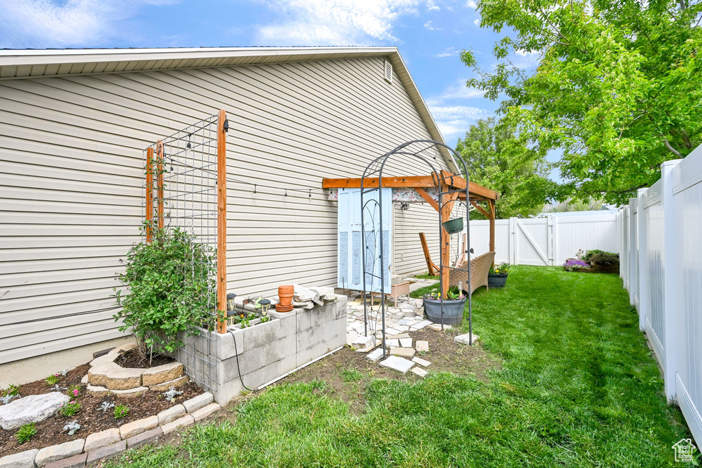 View of yard featuring a gate