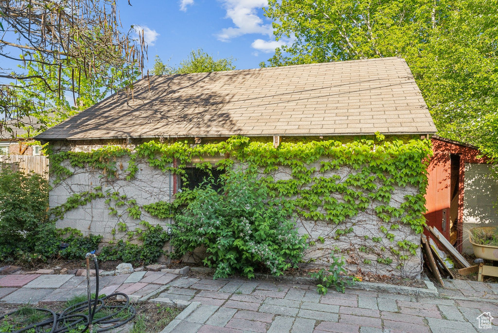 Exterior space with roof with shingles