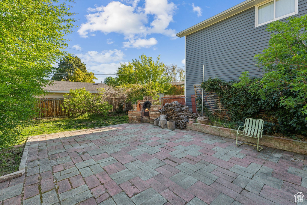 View of patio with a fenced backyard