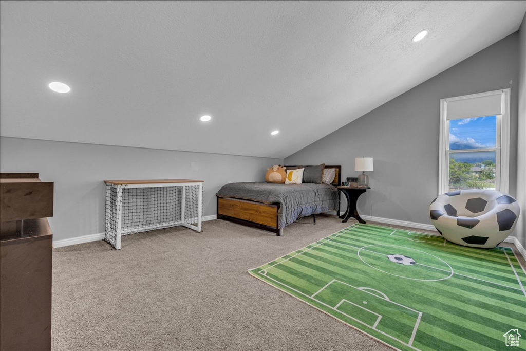 Bedroom featuring lofted ceiling, carpet floors, recessed lighting, and baseboards