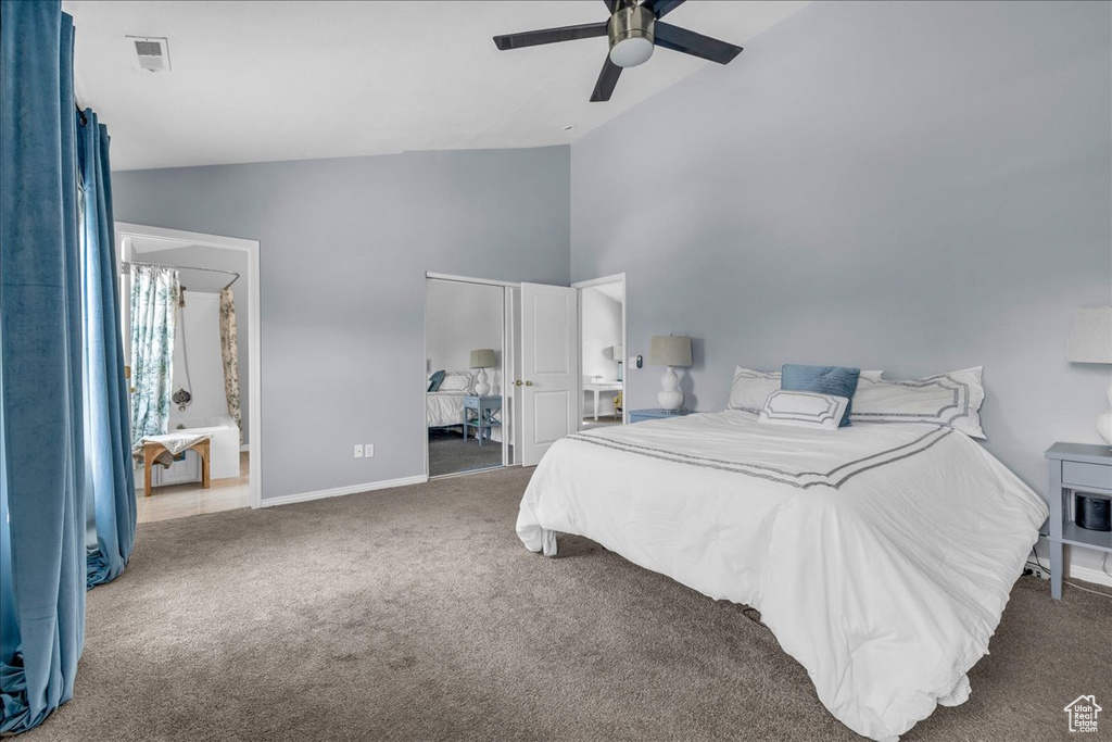 Bedroom featuring carpet floors, high vaulted ceiling, baseboards, and ceiling fan