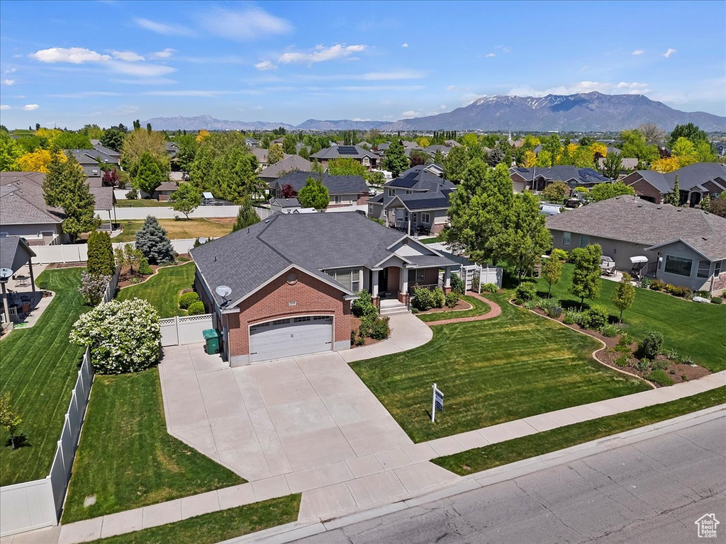 Aerial perspective of suburban area with a mountain backdrop