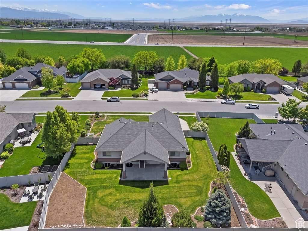 Aerial perspective of suburban area with a mountain backdrop