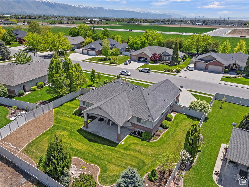 Aerial perspective of suburban area featuring a mountainous background