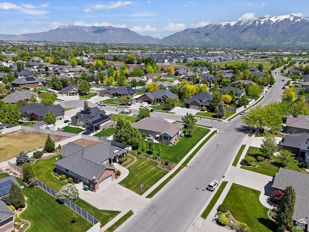 Aerial perspective of suburban area featuring a mountainous background