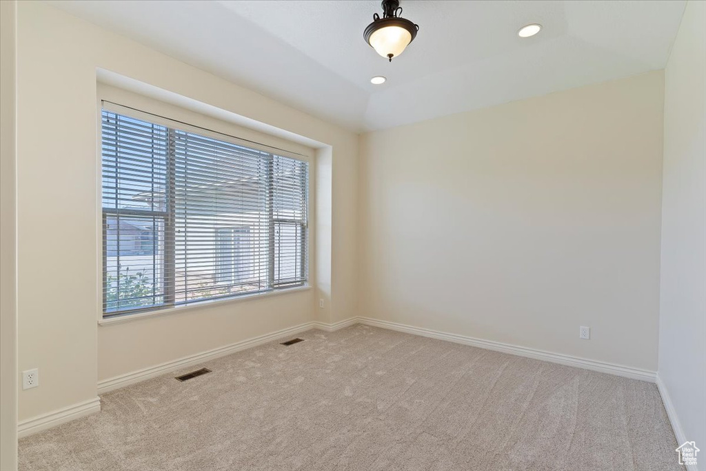 Unfurnished room featuring carpet floors, baseboards, and recessed lighting
