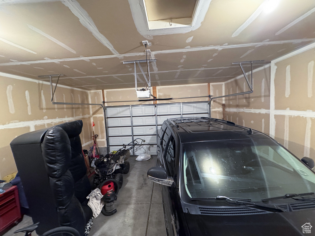 Garage featuring a garage door opener
