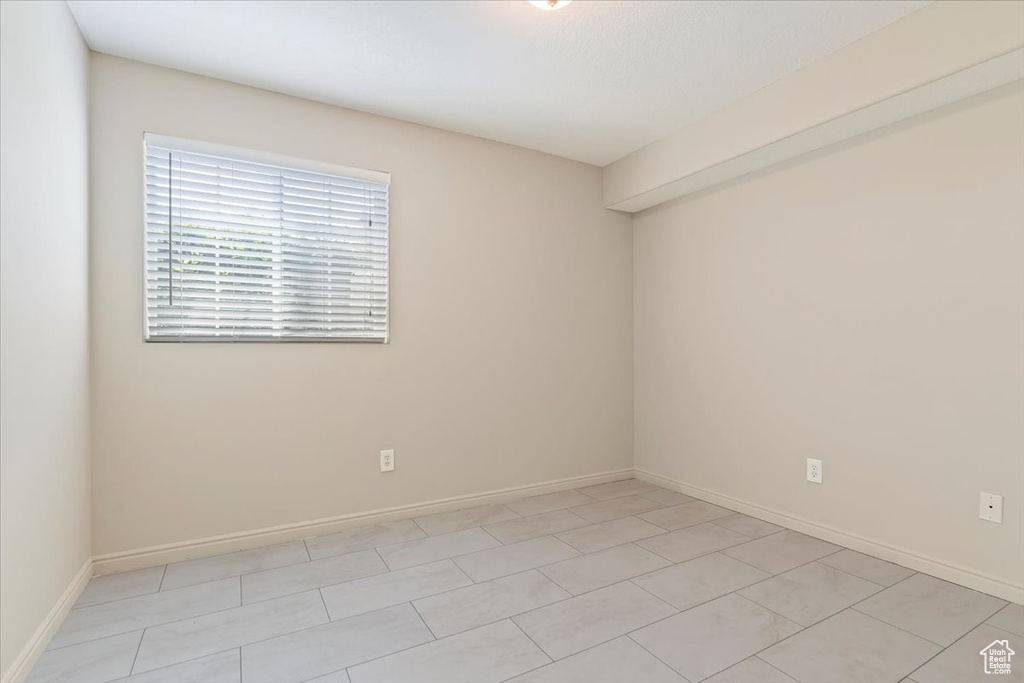 Unfurnished room featuring baseboards
