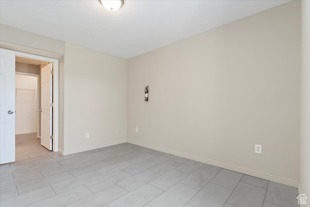 Unfurnished room featuring baseboards