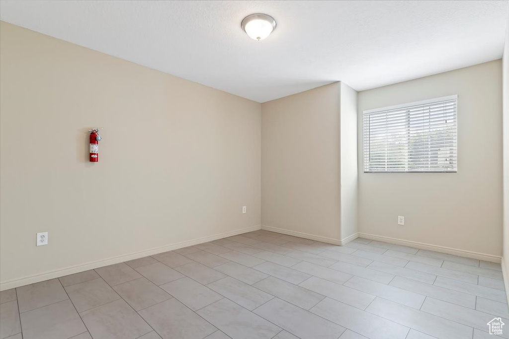 Empty room featuring baseboards