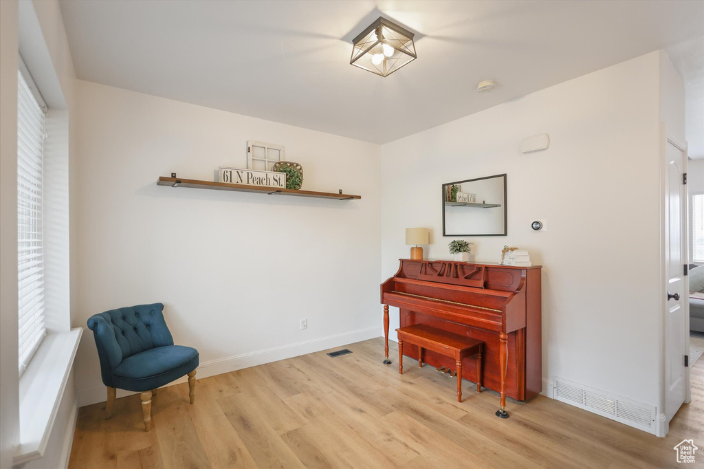 Living area featuring wood finished floors and baseboards