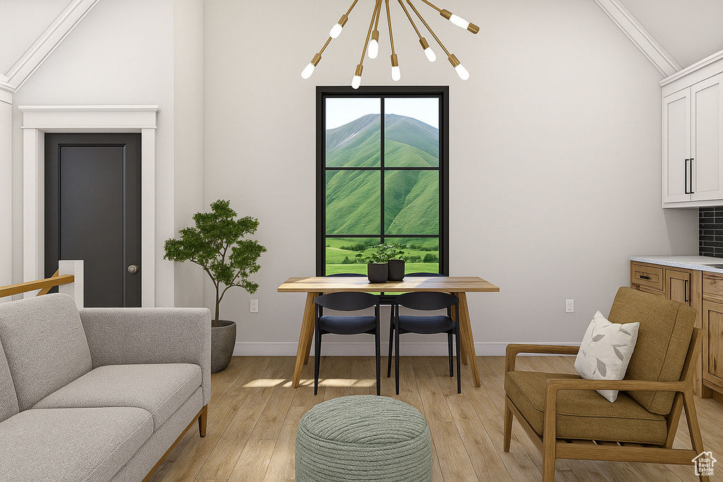 Living area featuring lofted ceiling, a chandelier, light wood-type flooring, and baseboards