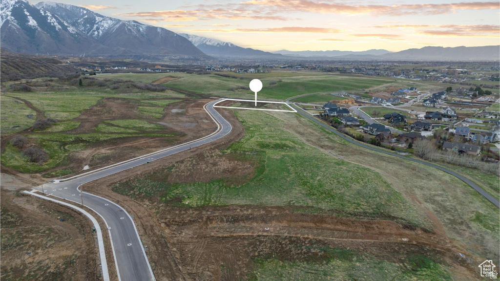 Aerial view of property's location featuring mountains