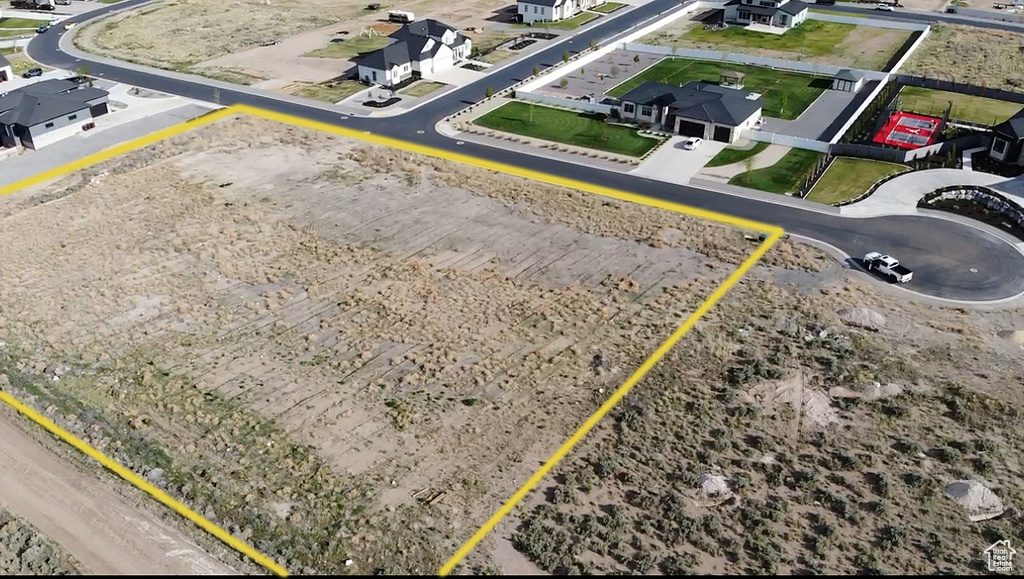Aerial perspective of suburban area featuring property parcel outlined