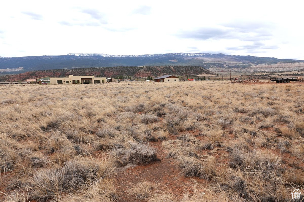 View of mountain backdrop with rural landscape