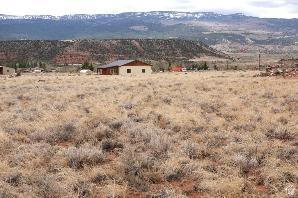 View of mountain background featuring rural landscape