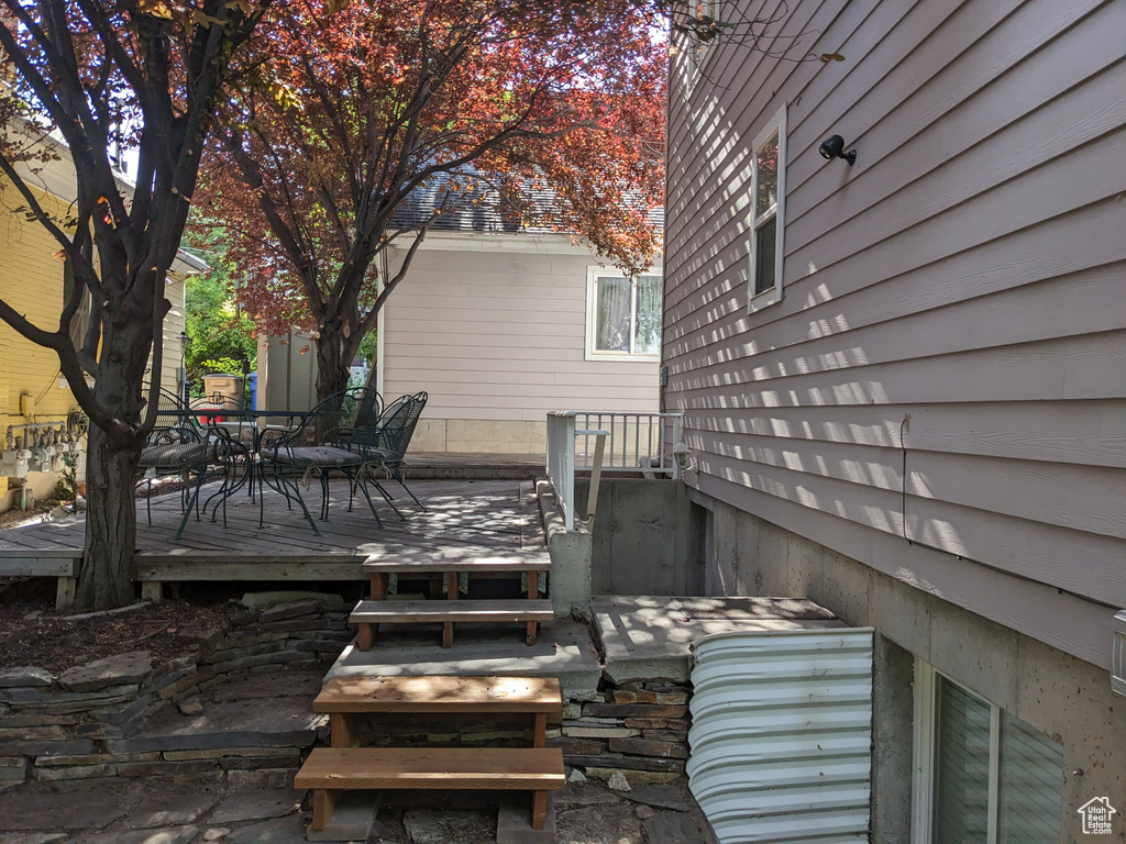 Wooden terrace featuring outdoor dining space