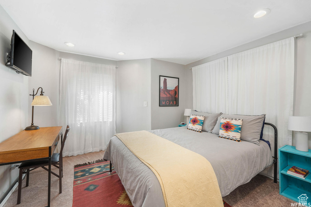 Carpeted bedroom with recessed lighting