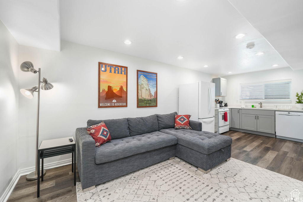 Living room with wood finished floors and recessed lighting