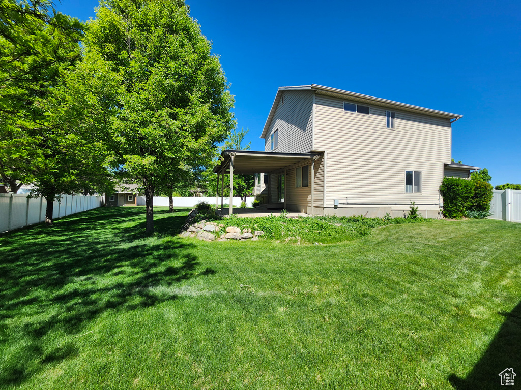 Back of property with a patio area