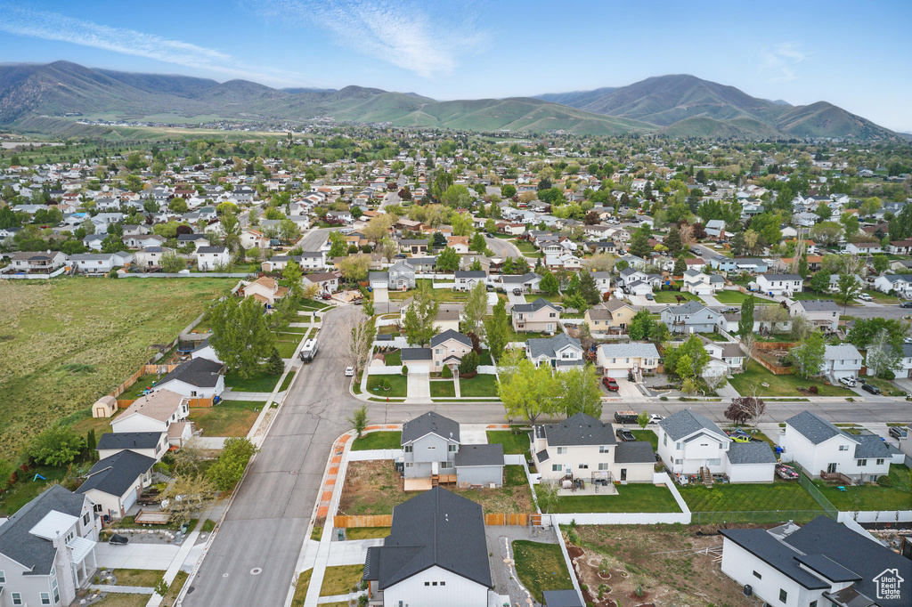 Aerial perspective of suburban area with a mountain backdrop