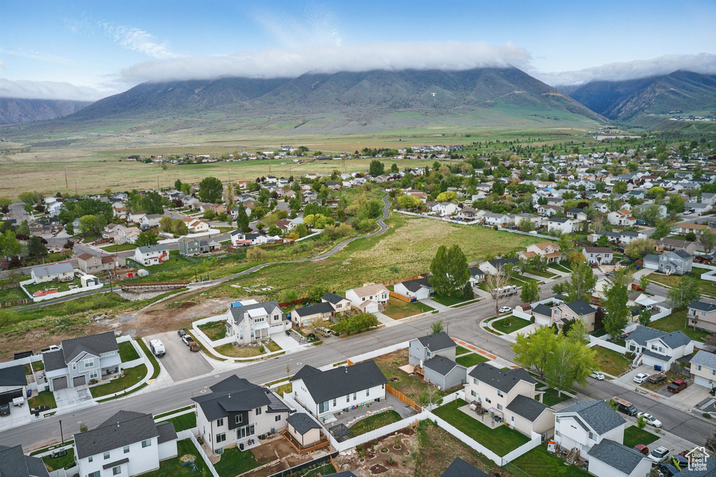Aerial perspective of suburban area featuring a mountain backdrop