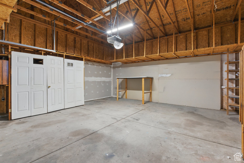 Garage featuring a garage door opener