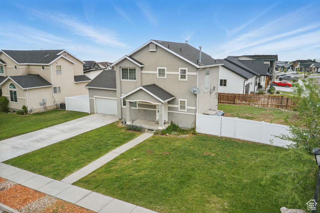View of front of home featuring a residential view, driveway, a shingled roof, stucco siding, and central air condition unit