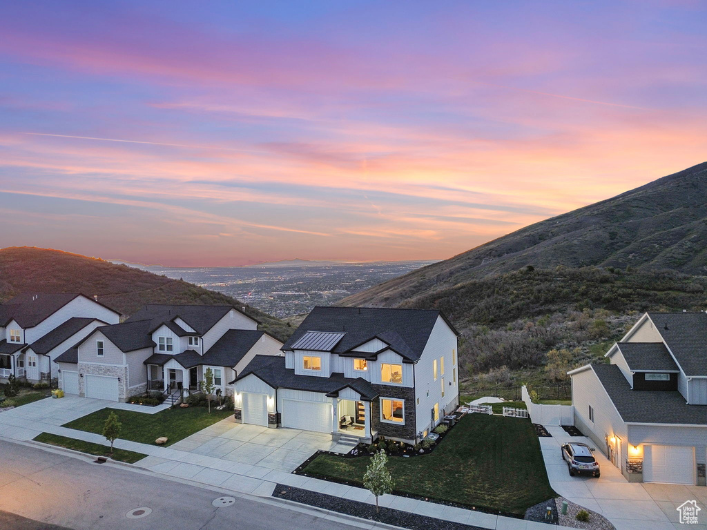 Aerial view at dusk of a residential view and a mountain view