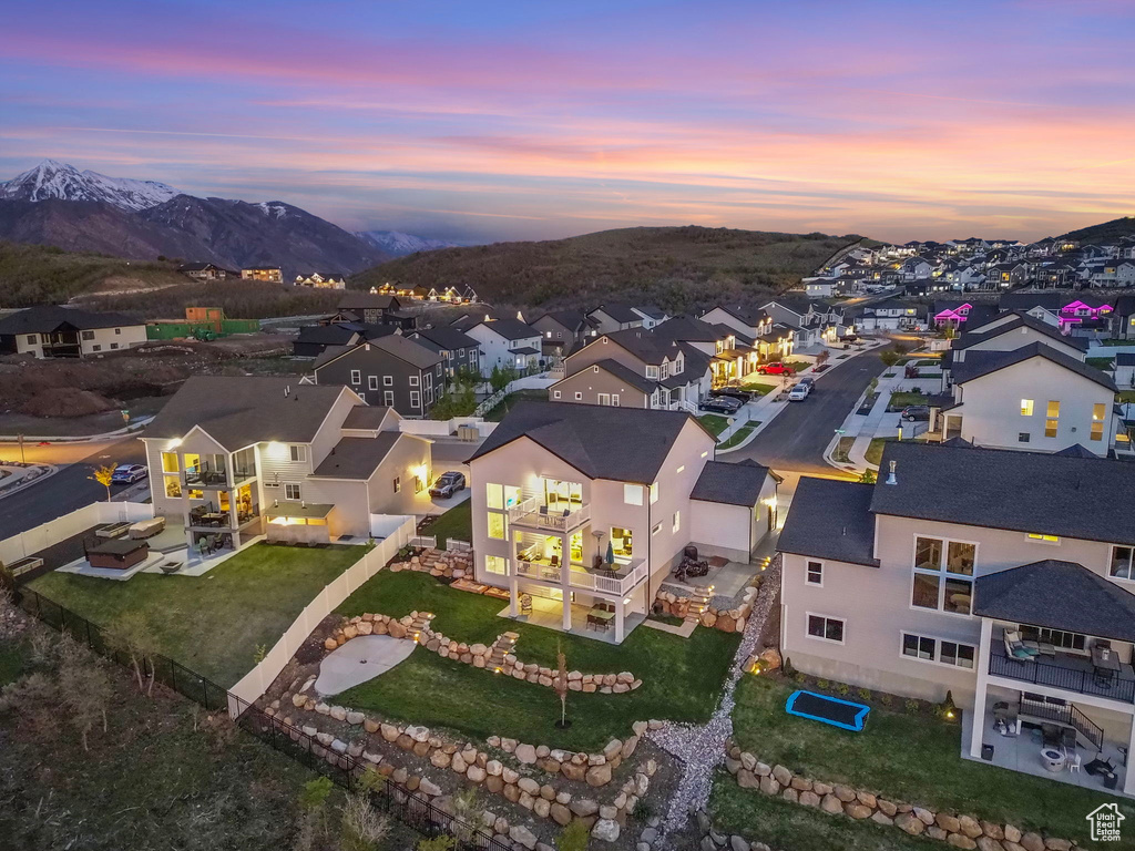 Aerial perspective of suburban area featuring a mountainous background