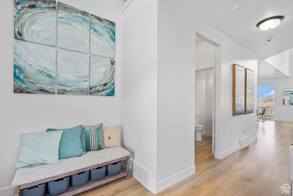 Sitting room featuring wood finished floors and baseboards