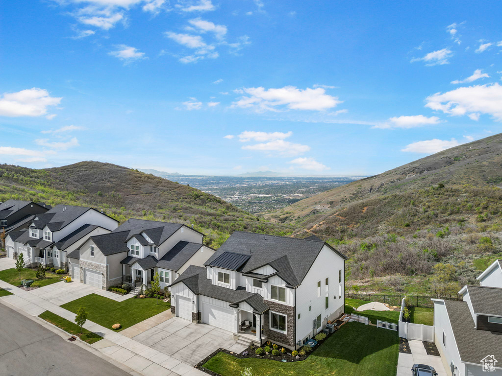 Aerial perspective of suburban area with a mountain backdrop