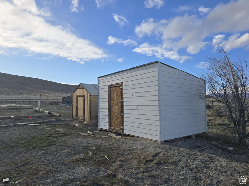 View of shed with a mountain view