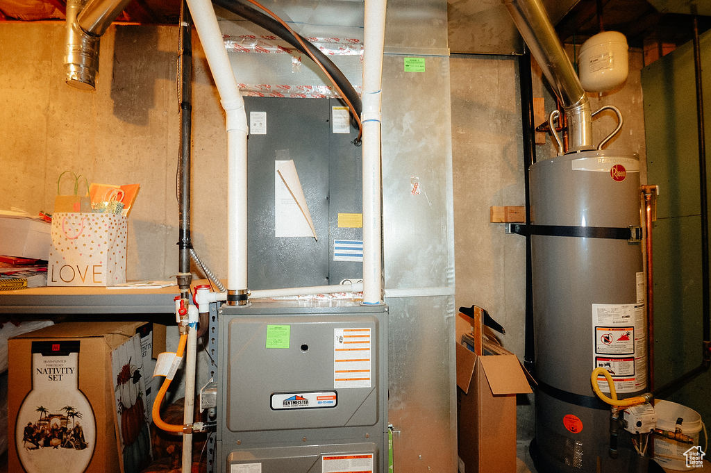 Utility room featuring water heater