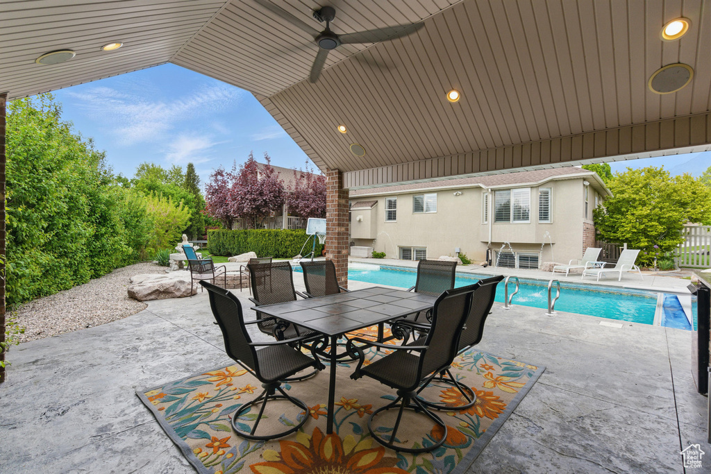 View of patio / terrace featuring fence and ceiling fan